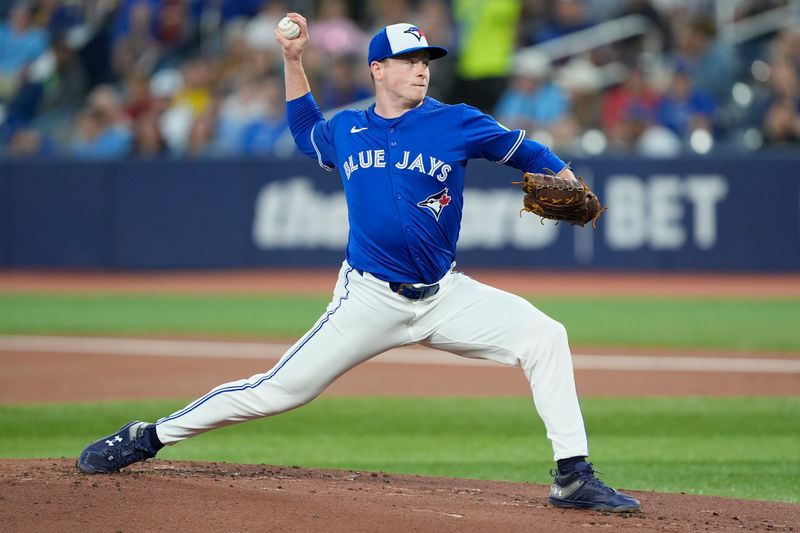 Sep 25, 2025; Toronto, Ontario, CAN; Toronto Blue Jays starting pitcher Louie Varland (77) pitches to the Boston Red Sox during the first inning at Rogers Centre. Mandatory Credit: John E. Sokolowski-Imagn Images