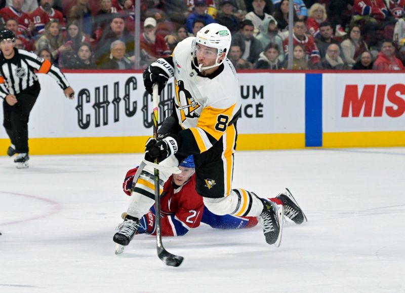 Oct 14, 2024; Montreal, Quebec, CAN; Pittsburgh Penguins forward Michael Bunting (8) takes a shot while Montreal Canadiens defenseman Kaiden Guhle (21) defends during the third period at the Bell Centre. Mandatory Credit: Eric Bolte-Imagn Images