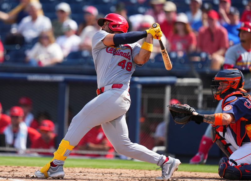 Mar 5, 2025; West Palm Beach, Florida, USA; St. Louis Cardinals catcher Ivan Herrera (48) hits a single against the Houston Astros during the third inning at CACTI Park of the Palm Beaches. Mandatory Credit: Rich Storry-Imagn Images