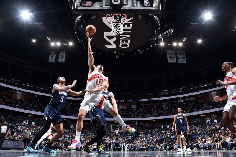 ORLANDO, FL - MARCH 17: Jordan Nwora #13 of the Toronto Raptors drives to the basket during the game against the Orlando Magic on March 17, 2024 at the Kia Center in Orlando, Florida. NOTE TO USER: User expressly acknowledges and agrees that, by downloading and or using this photograph, User is consenting to the terms and conditions of the Getty Images License Agreement. Mandatory Copyright Notice: Copyright 2024 NBAE (Photo by Fernando Medina/NBAE via Getty Images)