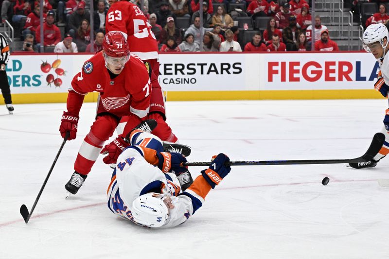 Nov 21, 2024; Detroit, Michigan, USA;  New York Islanders center Jean-Gabriel Pageau (44) battles for the puck against Detroit Red Wings defenseman Simon Edvinsson (77) in the first period at Little Caesars Arena. Mandatory Credit: Lon Horwedel-Imagn Images