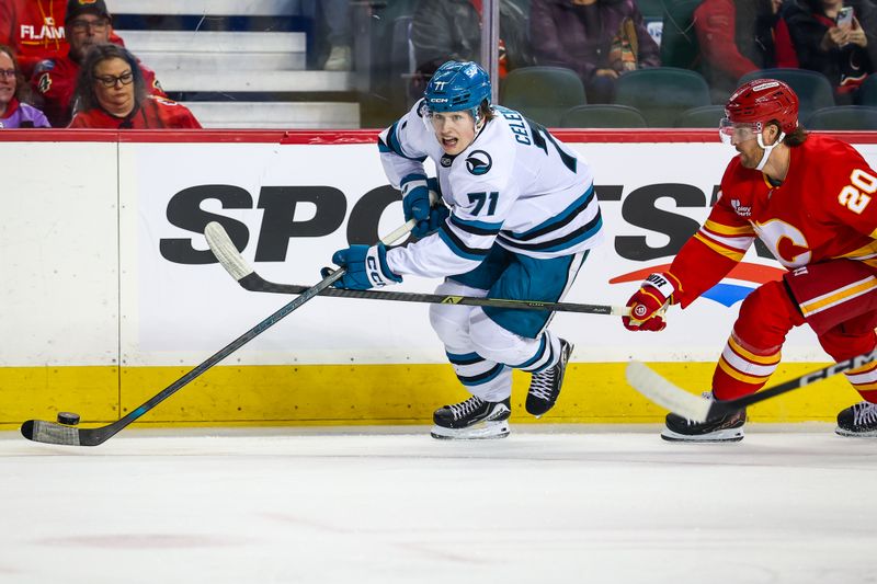 Nov 13, 2025; Calgary, Alberta, CAN; San Jose Sharks center Macklin Celebrini (71) controls the puck against Calgary Flames left wing Blake Coleman (20) during the first period at Scotiabank Saddledome. Mandatory Credit: Sergei Belski-Imagn Images