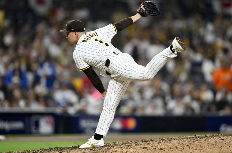 Oct 9, 2024; San Diego, California, USA; San Diego Padres pitcher Yuki Matsui (1) throws in the ninth inning against the Los Angeles Dodgers during game four of the NLDS for the 2024 MLB Playoffs at Petco Park.  Mandatory Credit: Denis Poroy-Imagn Images