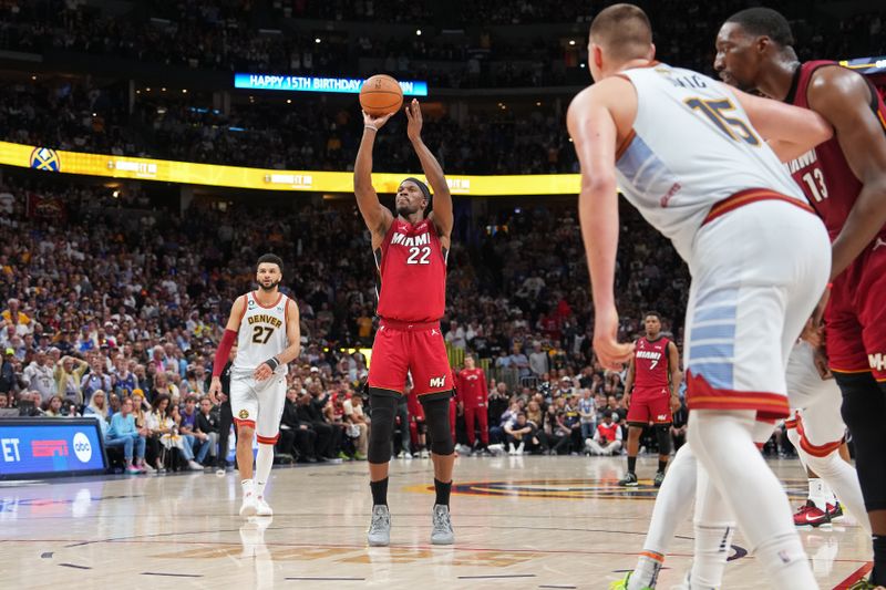 DENVER, CO - JUNE 12: Jimmy Butler #22 of the Miami Heat shoots a free throw during Game Five of the 2023 NBA Finals on June 12, 2023 at Ball Arena in Denver, Colorado. NOTE TO USER: User expressly acknowledges and agrees that, by downloading and or using this Photograph, user is consenting to the terms and conditions of the Getty Images License Agreement. Mandatory Copyright Notice: Copyright 2023 NBAE (Photo by Jesse D. Garrabrant/NBAE via Getty Images)