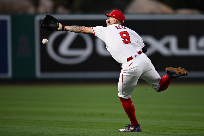 May 11, 2024; Anaheim, California, USA; Los Angeles Angels shortstop Zach Neto (9) attempts to make a catch against the Kansas City Royals during the sixth inning at Angel Stadium. Mandatory Credit: Jonathan Hui-USA TODAY Sports