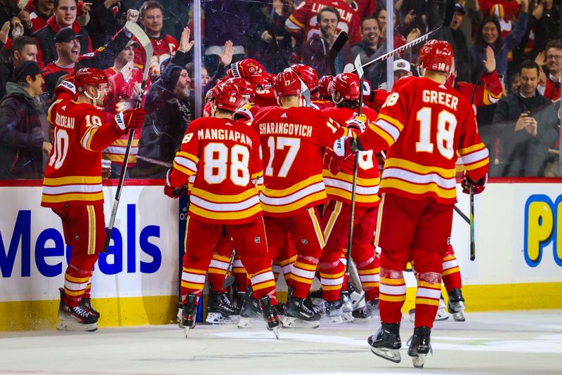 Nov 30, 2023; Calgary, Alberta, CAN; Calgary Flames celebrate after defeating Dallas Stars at Scotiabank Saddledome. Mandatory Credit: Sergei Belski-USA TODAY Sports