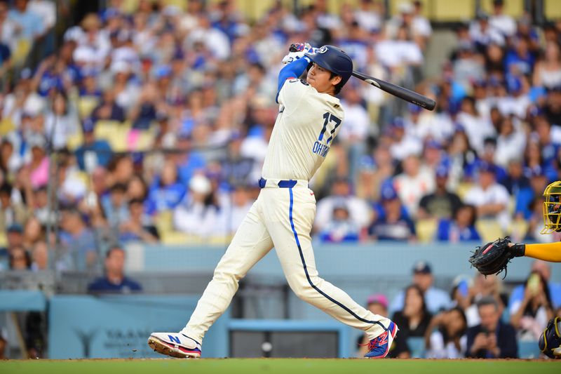 Jul 19, 2025; Los Angeles, California, USA; Los Angeles Dodgers designated hitter Shohei Ohtani (17) hits a two run home run during the third inning against the Milwaukee Brewers at Dodger Stadium. Mandatory Credit: Gary A. Vasquez-Imagn Images