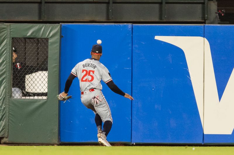 Jul 12, 2024; San Francisco, California, USA; Minnesota Twins center fielder Byron Buxton (25) chases the ball against the San Francisco Giants during the sixth inning at Oracle Park. Mandatory Credit: John Hefti-USA TODAY Sports