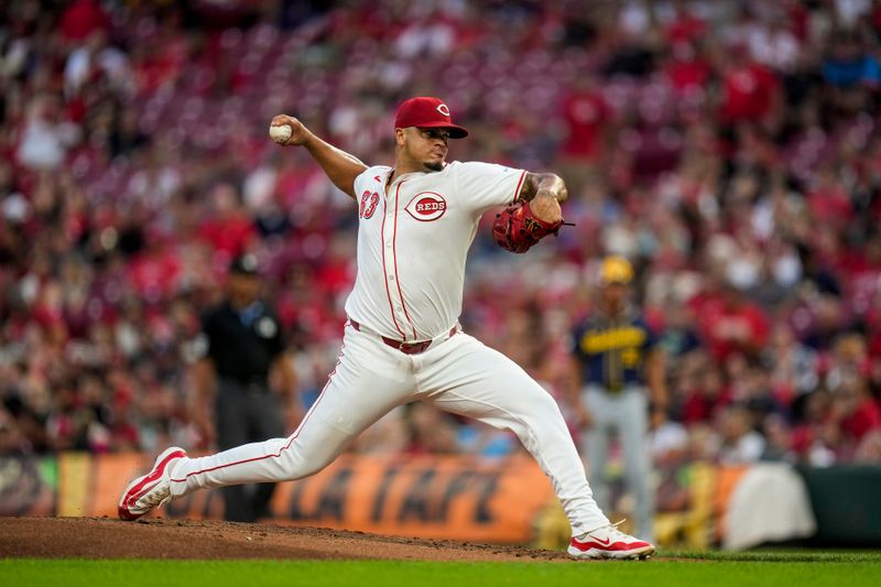 Aug 31, 2024; Cincinnati, Ohio, USA; Cincinnati Reds pitcher Fernando Cruz (63) throws against the Milwaukee Brewers in the first inning at Great American Ball Park. Mandatory Credit: Cara Owsley/The Cincinnati Enquirer-USA TODAY Sports