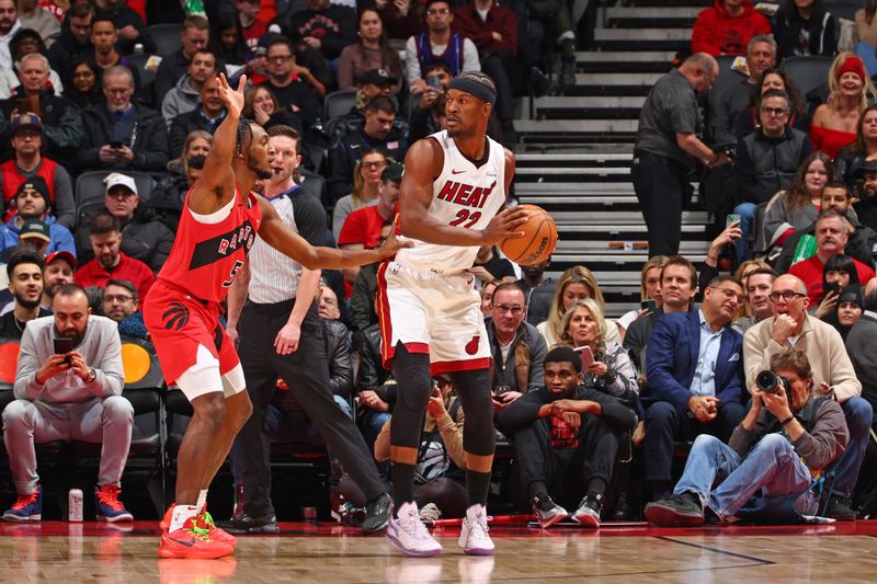 TORONTO, CANADA - JANUARY 17: Jimmy Butler #22 of the Miami Heat looks to pass the ball during the game against the Toronto Raptors on January 17, 2024 at the Scotiabank Arena in Toronto, Ontario, Canada.  NOTE TO USER: User expressly acknowledges and agrees that, by downloading and or using this Photograph, user is consenting to the terms and conditions of the Getty Images License Agreement.  Mandatory Copyright Notice: Copyright 2024 NBAE (Photo by Vaughn Ridley/NBAE via Getty Images)