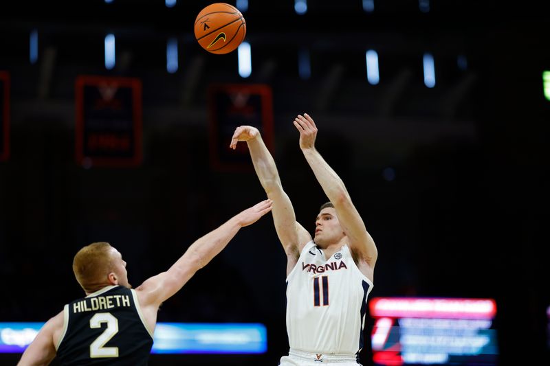 Feb 17, 2024; Charlottesville, Virginia, USA; Virginia Cavaliers guard Isaac McKneely (11) shoots the ball over Wake Forest Demon Deacons guard Cameron Hildreth (2) in the second half at John Paul Jones Arena. Mandatory Credit: Geoff Burke-USA TODAY Sports