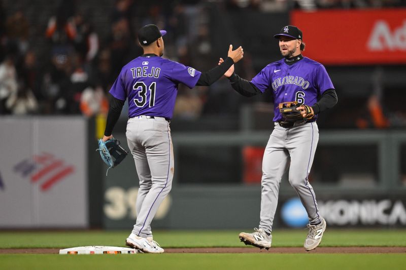 May 1, 2025; San Francisco, California, USA; Colorado Rockies second baseman Kyle Farmer (6) and shortstop Alan Trejo (31) celebrate their win over the San Francisco Giants in the ninth inning at Oracle Park. Mandatory Credit: Eakin Howard-Imagn Images