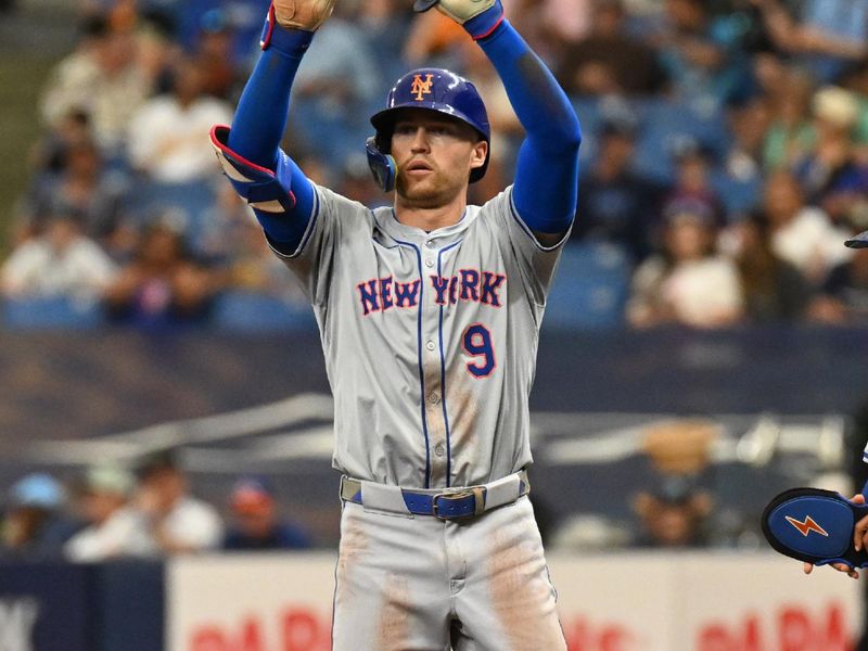 May 5, 2024; St. Petersburg, Florida, USA; New York Mets left fielder Brandon Nimmo (9) reacts after hitting RBI single in the fourth inning against the Tampa Bay Rays  at Tropicana Field. Mandatory Credit: Jonathan Dyer-USA TODAY Sports