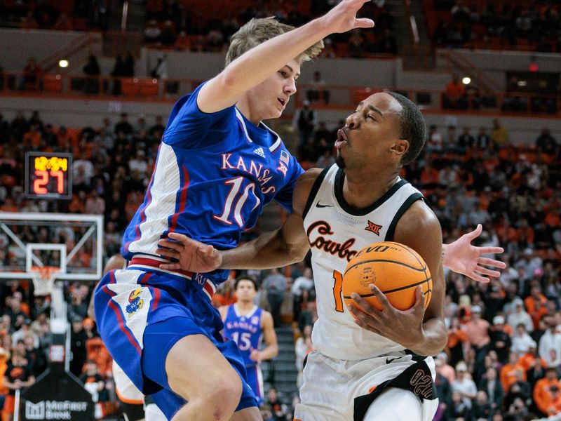 Jan 16, 2024; Stillwater, Oklahoma, USA; Oklahoma State Cowboys guard Bryce Thompson (1) collides with Kansas Jayhawks guard Johnny Furphy (10) during the first half at Gallagher-Iba Arena. Mandatory Credit: William Purnell-USA TODAY Sports