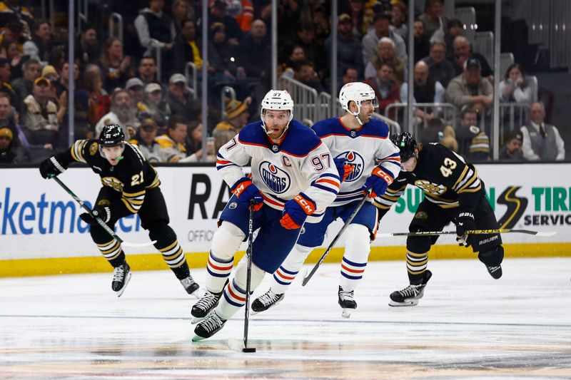 Mar 5, 2024; Boston, Massachusetts, USA; Edmonton Oilers center Connor McDavid (97) brings the puck up the ice against the Boston Bruins during the third period at TD Garden. Mandatory Credit: Winslow Townson-USA TODAY Sports