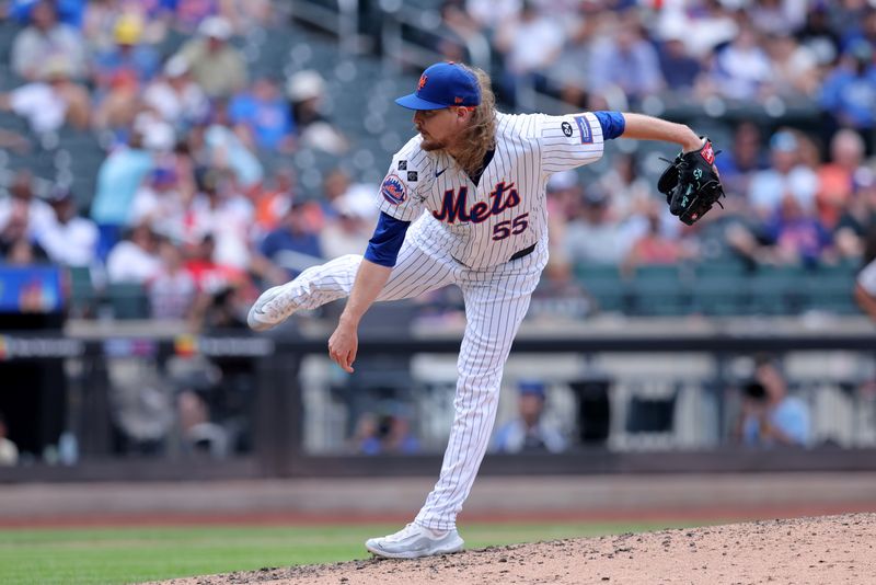 Jul 28, 2024; New York City, New York, USA; New York Mets relief pitcher Ryne Stanek (55) follows through on a pitch against the Atlanta Braves during the seventh inning at Citi Field. Mandatory Credit: Brad Penner-USA TODAY Sports