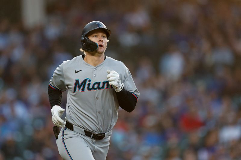 May 14, 2025; Chicago, Illinois, USA; Miami Marlins center fielder Kyle Stowers (28) rounds the bases after hitting a solo home run against the Chicago Cubs during the fourth inning at Wrigley Field. Mandatory Credit: Kamil Krzaczynski-Imagn Images