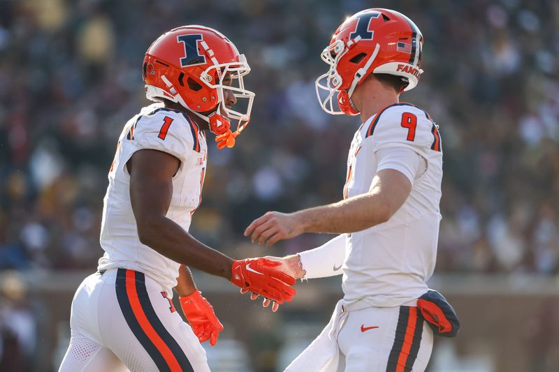 Nov 4, 2023; Minneapolis, Minnesota, USA; Illinois Fighting Illini wide receiver Isaiah Williams (1) celebrates his touchdown with quarterback Luke Altmyer (9) during the first half against the Minnesota Golden Gophers at Huntington Bank Stadium. Mandatory Credit: Matt Krohn-USA TODAY Sports