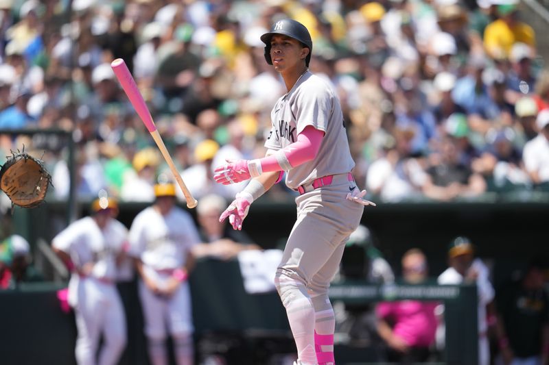 May 11, 2025; West Sacramento, California, USA; New York Yankees infielder Oswaldo Cabrera (95) tosses his bat after drawing a walk against the Athletics in the second inning at Sutter Health Park. Mandatory Credit: Cary Edmondson-Imagn Images