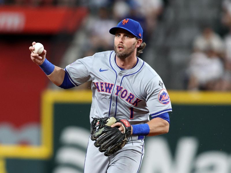 Jun 18, 2024; Arlington, Texas, USA; New York Mets second base Jeff McNeil (1) runs towards third base while in a rundown in the fourth inning against the Texas Rangers at Globe Life Field. Mandatory Credit: Tim Heitman-USA TODAY Sports