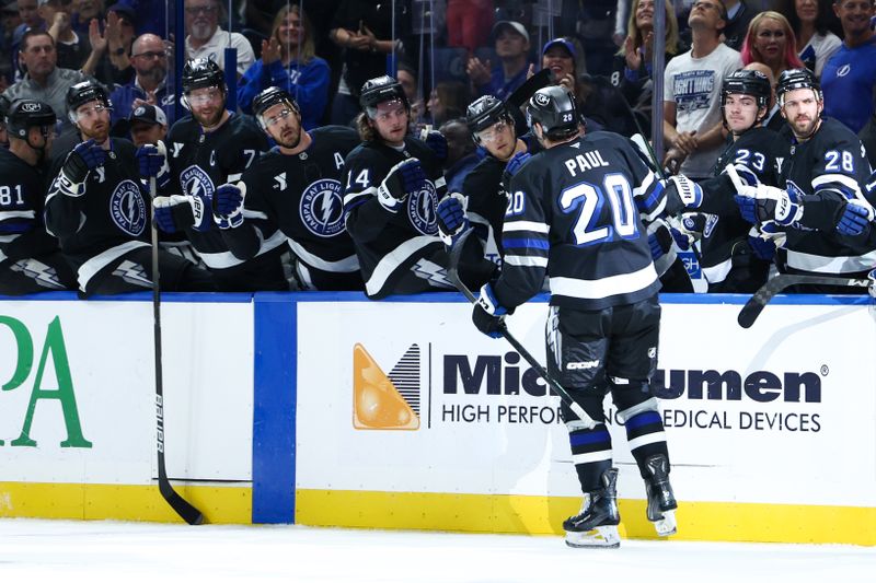 Nov 16, 2024; Tampa, Florida, USA; Tampa Bay Lightning left wing Nick Paul (20) celebrates after scoring a goal against the New Jersey Devils in the first period at Amalie Arena. Mandatory Credit: Nathan Ray Seebeck-Imagn Images