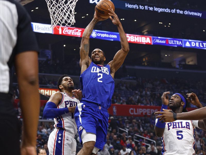 LOS ANGELES, CALIFORNIA - JANUARY 17:  Kawhi Leonard #2 of the LA Clippers takes a shot against Tobias Harris #12 of the Philadelphia 76ers in the first half at Crypto.com Arena on January 17, 2023 in Los Angeles, California.  NOTE TO USER: User expressly acknowledges and agrees that, by downloading and/or using this photograph, user is consenting to the terms and conditions of the Getty Images License Agreement.  (Photo by Ronald Martinez/Getty Images)