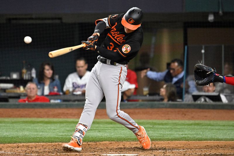 Oct 10, 2023; Arlington, Texas, USA; Baltimore Orioles first baseman Ryan O'Hearn (32) hits a single in the fourth inning against the Texas Rangers during game three of the ALDS for the 2023 MLB playoffs at Globe Life Field. Mandatory Credit: Jerome Miron-USA TODAY Sports