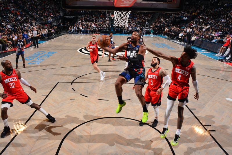 BROOKLYN, NY - JANUARY 27: Dennis Smith Jr. #4 of the Brooklyn Nets drives to the basket during the game against the Houston Rockets on January 27, 2024 at Barclays Center in Brooklyn, New York. NOTE TO USER: User expressly acknowledges and agrees that, by downloading and or using this Photograph, user is consenting to the terms and conditions of the Getty Images License Agreement. Mandatory Copyright Notice: Copyright 2024 NBAE (Photo by Jesse D. Garrabrant/NBAE via Getty Images)