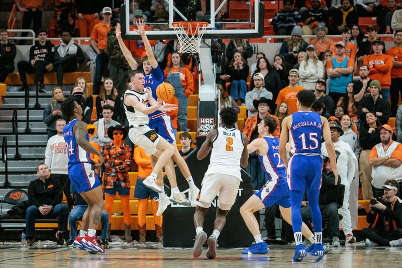 Jan 16, 2024; Stillwater, Oklahoma, USA; Oklahoma State Cowboys guard Connor Dow (13) collides with Kansas Jayhawks guard Johnny Furphy (10) under the basket during the second half at Gallagher-Iba Arena. Mandatory Credit: William Purnell-USA TODAY Sports