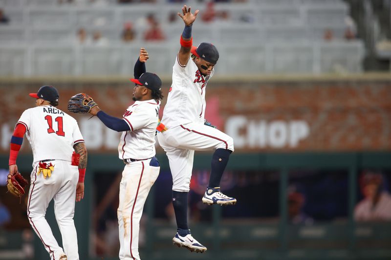 Sep 7, 2023; Atlanta, Georgia, USA; Atlanta Braves second baseman Ozzie Albies (1) and right fielder Ronald Acuna Jr. (13) celebrate after a victory against the St. Louis Cardinals at Truist Park. Mandatory Credit: Brett Davis-USA TODAY Sports
