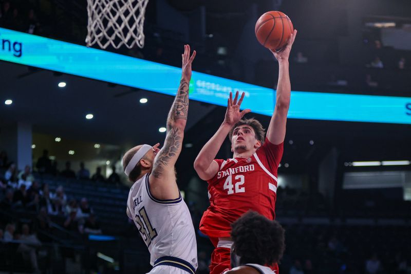 Feb 12, 2025; Atlanta, Georgia, USA; Stanford Cardinal forward Maxime Raynaud (42) shoots over Georgia Tech Yellow Jackets forward Duncan Powell (31) in the first half at McCamish Pavilion. Mandatory Credit: Brett Davis-Imagn Images
