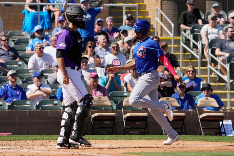 Mar 21, 2024; Salt River Pima-Maricopa, Arizona, USA; Chicago Cubs third baseman Christopher Morel (5) scores a run against the Colorado Rockies in the fourth inning at Salt River Fields at Talking Stick. Mandatory Credit: Rick Scuteri-USA TODAY Sports