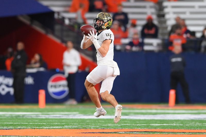 Nov 25, 2023; Syracuse, New York, USA; Wake Forest Demon Deacons wide receiver Taylor Morin (2) catches the ball against the Syracuse Orange during the second half at the JMA Wireless Dome. Mandatory Credit: Rich Barnes-USA TODAY Sports