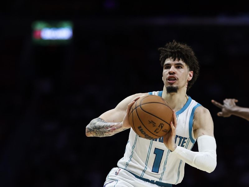 MIAMI, FLORIDA - MARCH 10: LaMelo Ball #1 of the Charlotte Hornets makes a pass against the Miami Heat during the fourth quarter at Kaseya Center on March 10, 2025 in Miami, Florida. NOTE TO USER: User expressly acknowledges and agrees that, by downloading and or using this photograph, User is consenting to the terms and conditions of the Getty Images License Agreement. (Photo by Brennan Asplen/Getty Images)