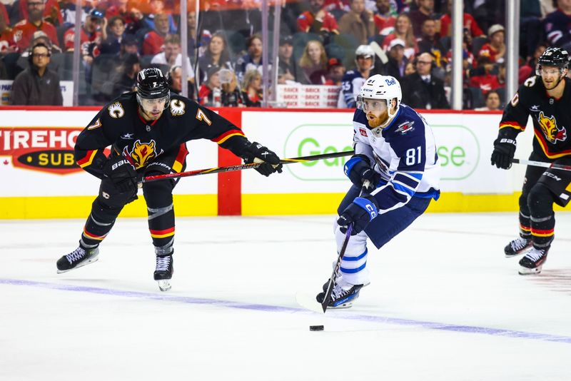 Oct 26, 2024; Calgary, Alberta, CAN; Winnipeg Jets left wing Kyle Connor (81) controls the puck against the Calgary Flames during the third period at Scotiabank Saddledome. Mandatory Credit: Sergei Belski-Imagn Images