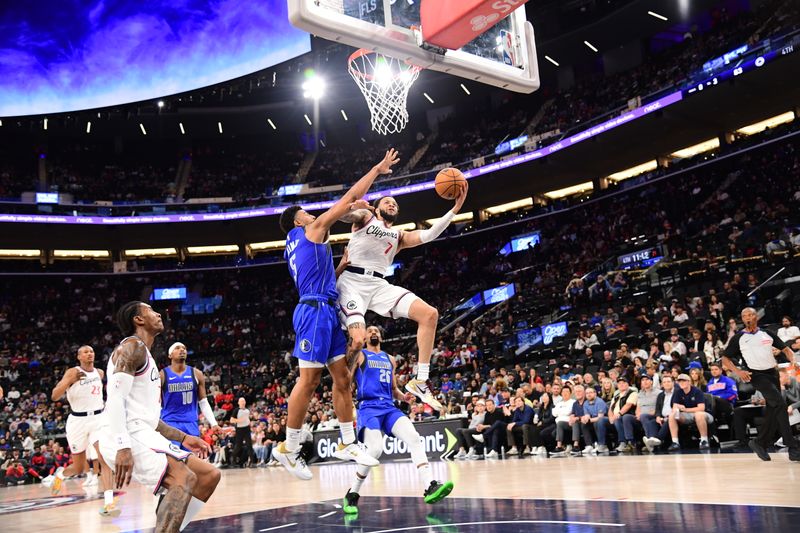 INGLEWOOD, CA - OCTOBER 14: Amir Coffey #7 of the LA Clippers drives to the basket during the game against the Dallas Mavericks during a NBA Preseason game on October 14, 2024 at the Intuit Dome in Inglewood, California. NOTE TO USER: User expressly acknowledges and agrees that, by downloading and/or using this Photograph, user is consenting to the terms and conditions of the Getty Images License Agreement. Mandatory Copyright Notice: Copyright 2024 NBAE (Photo by Adam Pantozzi/NBAE via Getty Images)