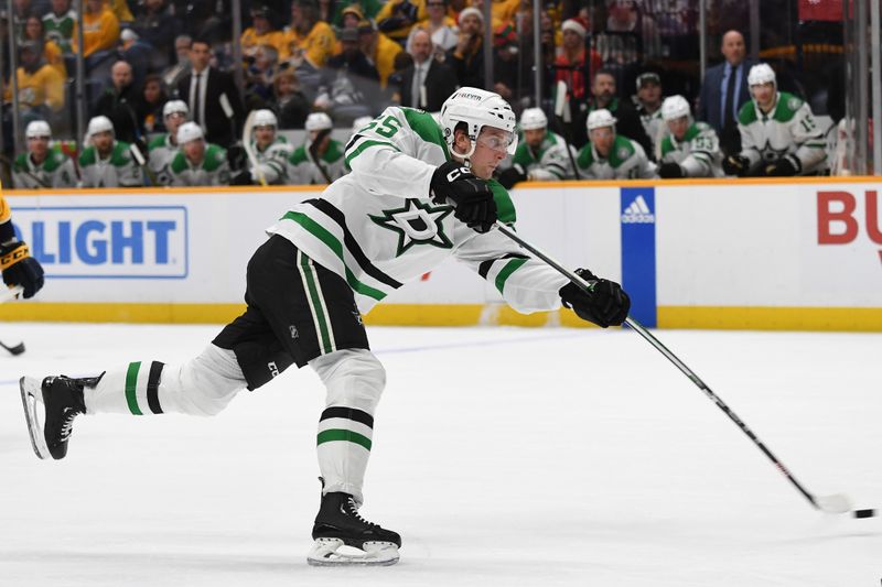 Dec 23, 2023; Nashville, Tennessee, USA; Dallas Stars defenseman Thomas Harley (55) shoots the puck during the second period against the Nashville Predators at Bridgestone Arena. Mandatory Credit: Christopher Hanewinckel-USA TODAY Sports