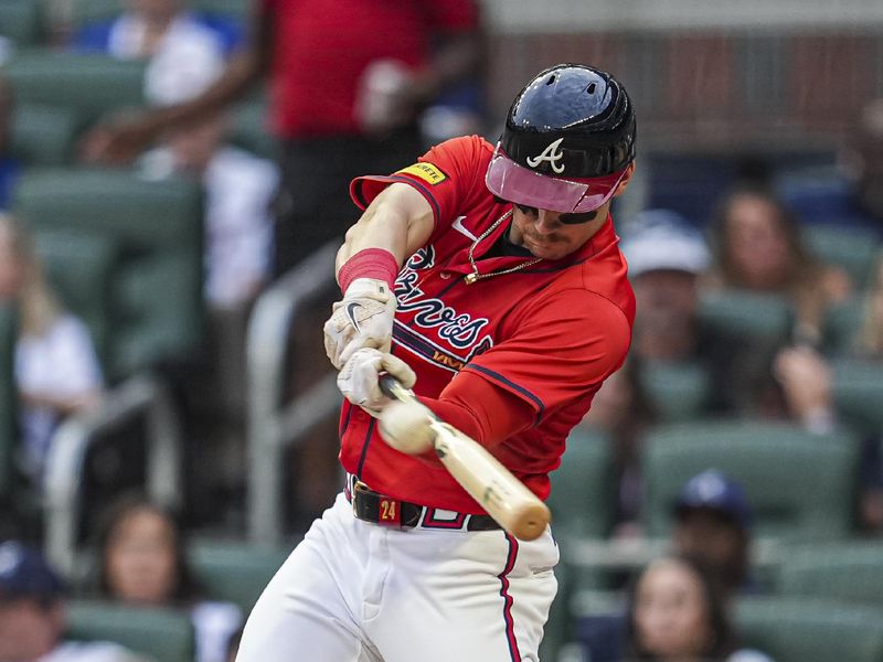 May 31, 2024; Cumberland, Georgia, USA; Atlanta Braves left fielder Jarred Kelenic (24) hits a double to drive in two runs against the Oakland Athletics during the second inning at Truist Park. Mandatory Credit: Dale Zanine-USA TODAY Sports