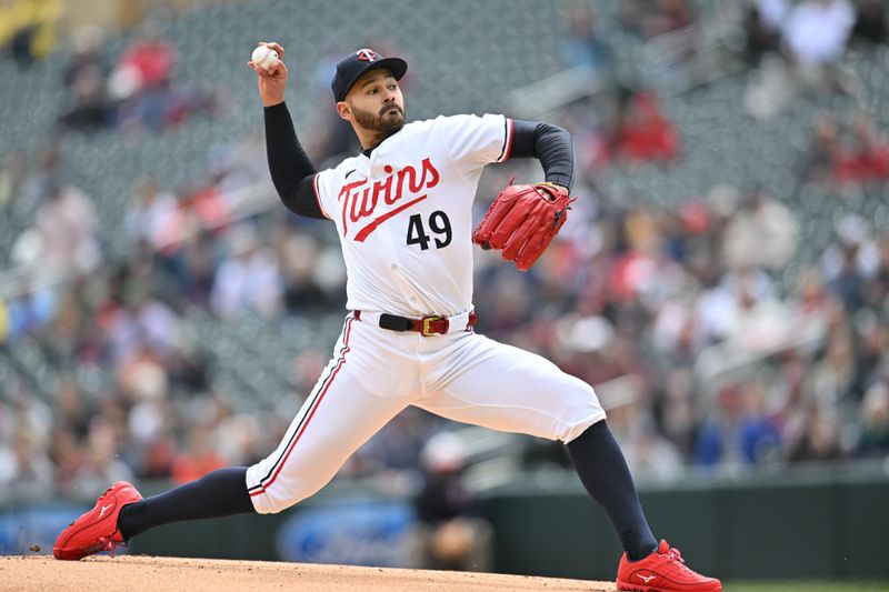 May 4, 2024; Minneapolis, Minnesota, USA; Minnesota Twins pitcher Pablo López (49) throws a pitch against the Minnesota Twins during the first inning at Target Field. Mandatory Credit: Jeffrey Becker-USA TODAY Sports