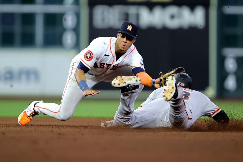 May 2, 2023; Houston, Texas, USA; Houston Astros shortstop Jeremy Pena (3) tags out San Francisco Giants pinch runner Austin Slater (13) on a stolen base attempt during the eighth inning at Minute Maid Park. Mandatory Credit: Erik Williams-USA TODAY Sports