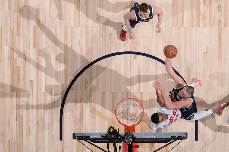 DENVER, CO - MARCH 11: Nikola Jokic #15 of the Denver Nuggets shoots the ball during the game against the Toronto Raptors on March 11, 2024 at the Ball Arena in Denver, Colorado. NOTE TO USER: User expressly acknowledges and agrees that, by downloading and/or using this Photograph, user is consenting to the terms and conditions of the Getty Images License Agreement. Mandatory Copyright Notice: Copyright 2024 NBAE (Photo by Bart Young/NBAE via Getty Images)