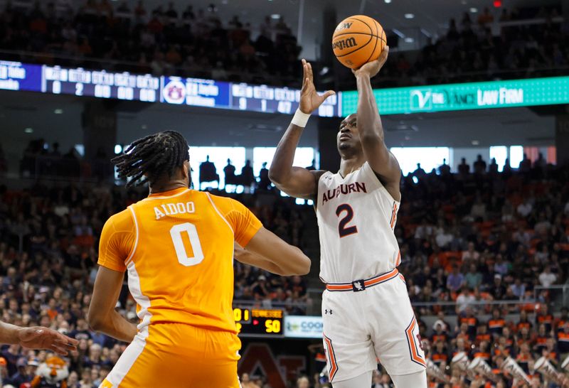 Mar 4, 2023; Auburn, Alabama, USA;  Auburn Tigers forward Jaylin Williams (2) shoots the ball against Tennessee Volunteers forward Jonas Aidoo (0) during the second half at Neville Arena. Mandatory Credit: John Reed-USA TODAY Sports