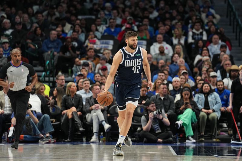 DALLAS, TX - FEBRUARY 12: Maxi Kleber #42 of the Dallas Mavericks handles the ball during the game against the Washington Wizards on February 12, 2024 at the American Airlines Center in Dallas, Texas. NOTE TO USER: User expressly acknowledges and agrees that, by downloading and or using this photograph, User is consenting to the terms and conditions of the Getty Images License Agreement. Mandatory Copyright Notice: Copyright 2024 NBAE (Photo by Glenn James/NBAE via Getty Images)