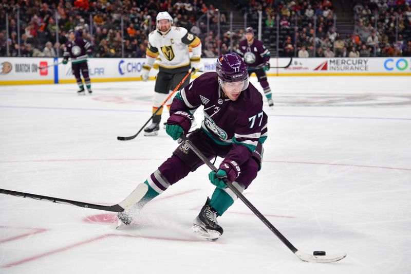 Dec 27, 2023; Anaheim, California, USA; Anaheim Ducks right wing Frank Vatrano (77) moves the puck against the Vegas Golden Knights during the third period at Honda Center. Mandatory Credit: Gary A. Vasquez-USA TODAY Sports