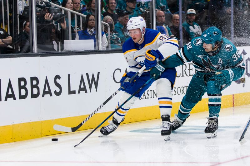 Nov 23, 2024; San Jose, California, USA; San Jose Sharks defenseman Mario Ferraro (38) defends Buffalo Sabres center Sam Lafferty (81) during the first period at SAP Center in San Jose. Mandatory Credit: John Hefti-Imagn Images