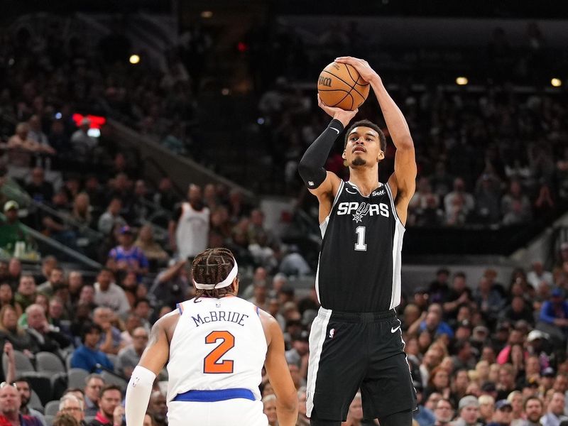 SAN ANTONIO, TX - MARCH 29:  Victor Wembanyama #1 of the San Antonio Spurs shoots a three point basket during the game against the New York Knicks on March 29, 2024 at the Frost Bank Center in San Antonio, Texas. NOTE TO USER: User expressly acknowledges and agrees that, by downloading and or using this photograph, user is consenting to the terms and conditions of the Getty Images License Agreement. Mandatory Copyright Notice: Copyright 2024 NBAE (Photos by Darren Carroll/NBAE via Getty Images)