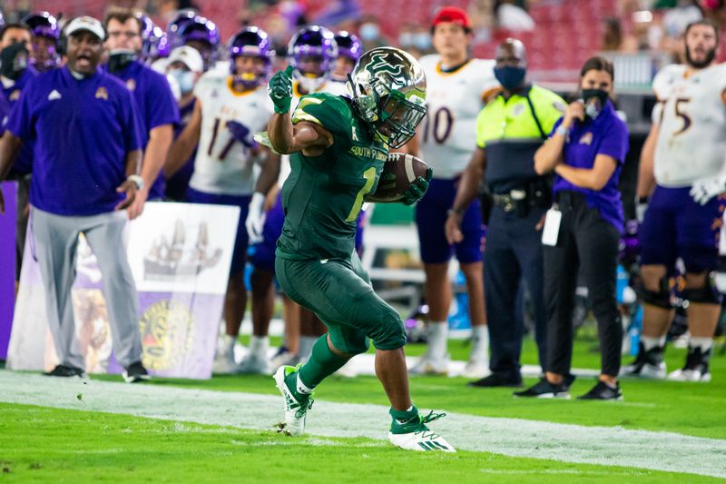 Oct 10, 2020; Tampa, Florida, USA; South Florida Bulls running back Johnny Ford (1) tiptoes on the sideline during a run in the second quarter of a game against the East Carolina Pirates at Raymond James Stadium. Mandatory Credit: Mary Holt-USA TODAY Sports