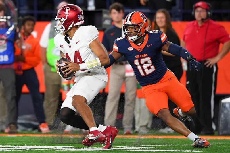 Sep 20, 2024; Syracuse, New York, USA; Syracuse Orange linebacker Anwar Sparrow (12) pressures Stanford Cardinal quarterback Ashton Daniels (14) during the second half at the JMA Wireless Dome. Mandatory Credit: Rich Barnes-Imagn Images