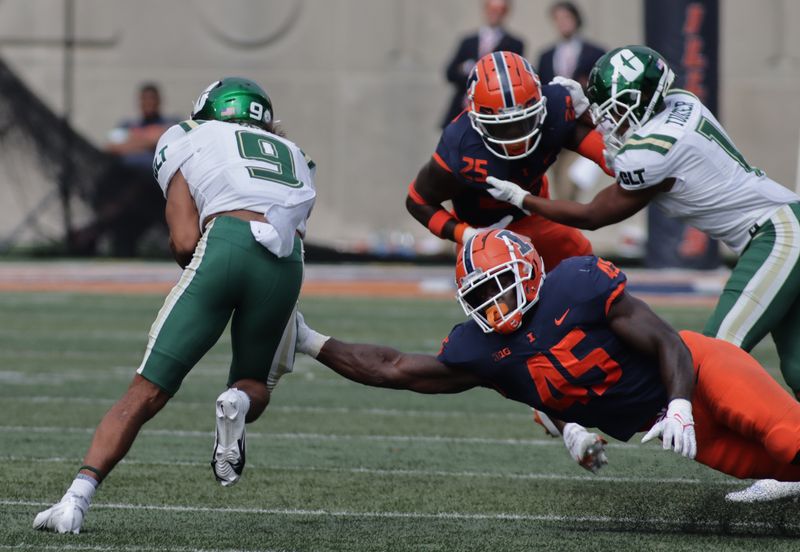 Oct 2, 2021; Champaign, Illinois, USA;  Illinois Fighting Illini linebacker Khalan Tolson (45) tries to bring down Charlotte 49ers wide receiver Elijah Spencer (9) in the second half at Memorial Stadium. Mandatory Credit: Ron Johnson-USA TODAY Sports



