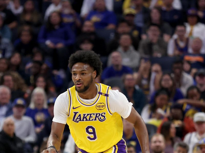 SAN FRANCISCO, CALIFORNIA - OCTOBER 18: Bronny James #9 of the Los Angeles Lakers dribbles the ball up court during the first half of their preseason game against the Golden State Warriors at Chase Center on October 18, 2024 in San Francisco, California.  NOTE TO USER: User expressly acknowledges and agrees that, by downloading and/or using this photograph, user is consenting to the terms and conditions of the Getty Images License Agreement.  (Photo by Ezra Shaw/Getty Images)